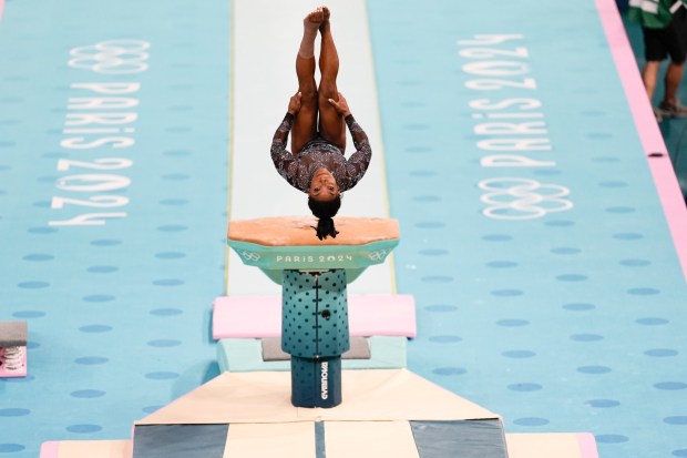 Simone Biles, of United States, competes on the vault during a women's artistic gymnastics qualification round at Bercy Arena at the 2024 Summer Olympics, Sunday, July 28, 2024, in Paris, France. (AP Photo/Francisco Seco)