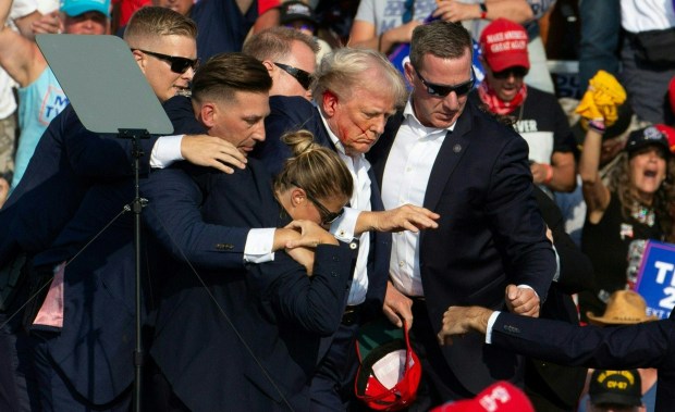 Former President Trump is rushed off a stage by Secret Service agents