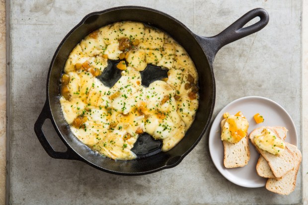 Baked Brie with Honeyed Apricots is a scrumptious appetizer that can be served with slices of baguette, crackers or Melba toast. (Courtesy of America's Test Kitchen)