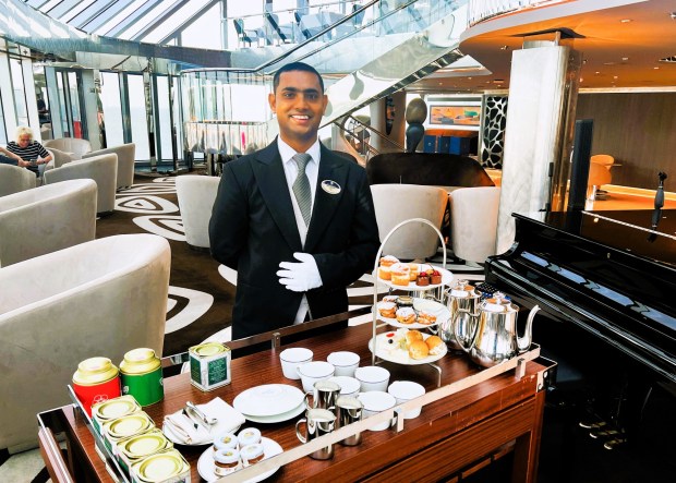 Afternoon tea in MSC Yacht Club comes with butler service. (Photo by David Dickstein)