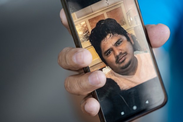 Wenceslao Contreras Ortiz shows a digital image of his nephew Alejandro Hernandez Fuentes, a victim of the Francis Scott Key Bridge collapse, in Xalapa, Mexico, Friday, March 29, 2024. Hernández Fuentes left Xalapa 15 years ago to join his mother and sister in the United States. (AP Photo/Felix Marquez)