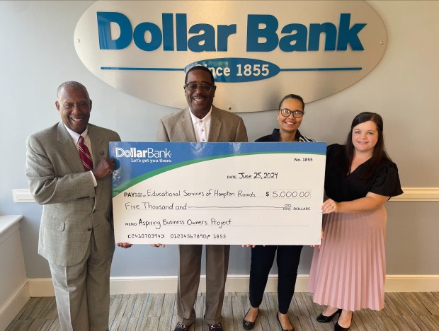 Educational Services of Hampton Roads accepts a grant sponsorship from Dollar Bank for its Aspiring Business Owners Project. The program provides a free 10-week technical assistance cohort designed to help new entrepreneurs develop and construct business plans to launch or improve their business ideation. Pictured from left are James Hinton Jr., community development, Dollar Bank; Dr. and Mrs. Tyrone and Linda Davis, owners of Educational Services of Hampton Roads Inc.; and Lisa Saunders, Dollar Bank Community Development. (Courtesy photo)