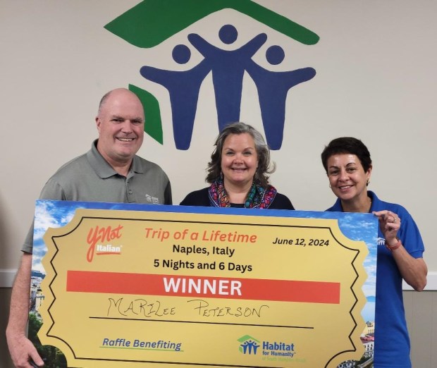 Marilee Peterson, center, with Frank and Diane Hruska of Habitat for Humanity of South Hampton Roads, won a six-day trip to Naples, Italy. The Hruskas participated in Ynot Italian's rewards program, eating enough meals over 13 years to earn the trip but decided to raffle it off to raise funds for the nonprofit. (Courtesy photo)