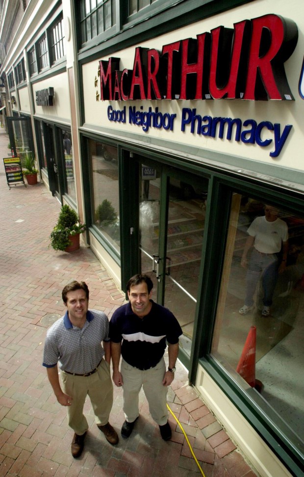 File photo of David Bass Jr., left, and Chris Lawrence owners of the MacArthur Pharmacy on Granby Ave in downtown Norfolk Oct. 27, 2000. The pharmacy will close later this month, according to building owner Bobby Wright. (Steve Earley / The Virginian-Pilot)