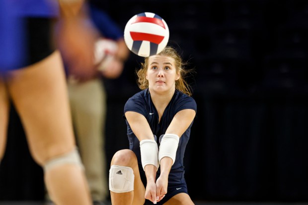 First Colonial's Kayla Foley sets the ball to a teammate during her Patriots' 3-1 victory over Riverside for the Class 5 state championship at VCU's Siegel Center on Nov. 17. Foley was named the VHSL Class 5 Player of the Year. BILLY SCHUERMAN/STAFF