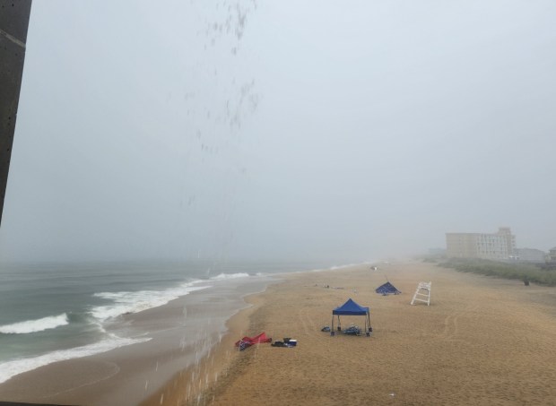 Abandoned belongings are seen on the beach south of Jennette's Pier in Nags Head during a thunderstorm on Thursday, June 27. (Corinne Saunders/The Virginian-Pilot)