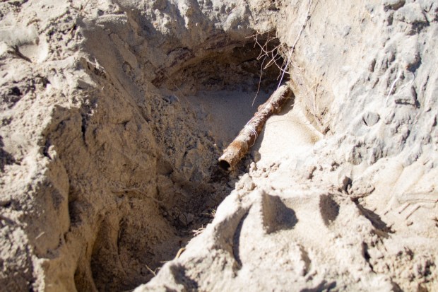 A pipe believed to be a fuel line sticks out of the sand on the beach near Buxton Beach Access. David Hallac, National Parks of Eastern North Carolina superintendent, said the pipe was longer just last week, but pieces have broken off. "Several times, there has been a substance inside that appeared to be a slurry of raw petroleum product, saltwater and sand, and so our staff just took another sample," Hallac said on Feb. 14. (Corinne Saunders/The Virginian-Pilot)