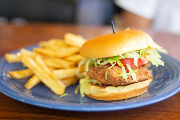 The Kill Devil Grill's crispy fried flounder sandwich special as served on June 25, 2024. (Corinne Saunders/The Virginian-Pilot)