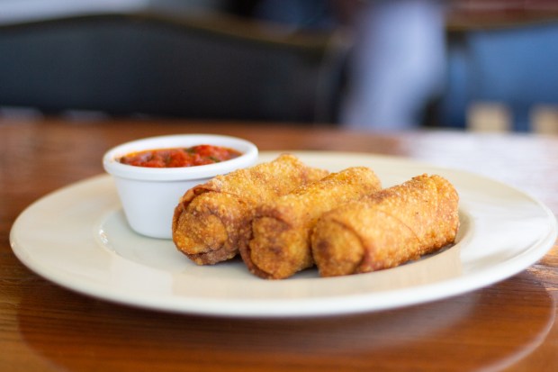 The Kill Devil Grill's cheese steak eggrolls as served on June 25, 2024. (Corinne Saunders/The Virginian-Pilot)