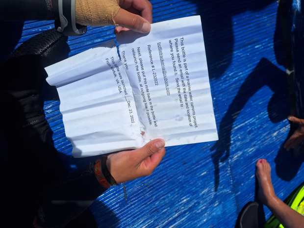 A mysterious message in a bottle was discovered in the water off the coast of Bermuda. (Photo courtesy of Blue Water Divers Bermuda)