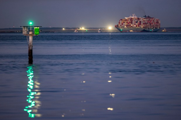 Photographed from Fort Monroe in Hampton, the Dali, the container ship that hit the Francis Scott Key Bridge in Baltimore causing a deadly collapse, crosses the Hampton Roads Bridge Tunnel and enters Norfolk around 5 A.M. on Tuesday, June 25, 2024. The Dali will unload containers at Virginia International Gateway in Portsmouth before being "parked" at Norfolk International Terminals and going to a shipyard for repairs. (Kendall Warner / The Virginian-Pilot)