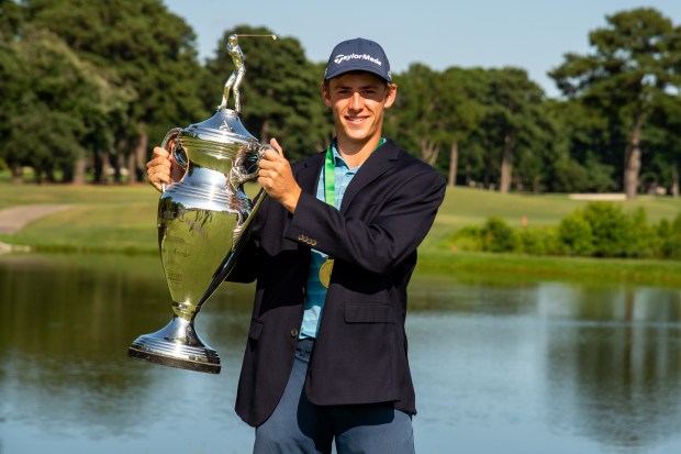 Trey Marrion holds the trophy after winning the 67th Eastern Amateur Golf Tournament at the Elizabeth Manor Golf & Country Club on Saturday, July 27, 2024, in Portsmouth, Va. (Mike Caudill for The Virginian-Pilot)