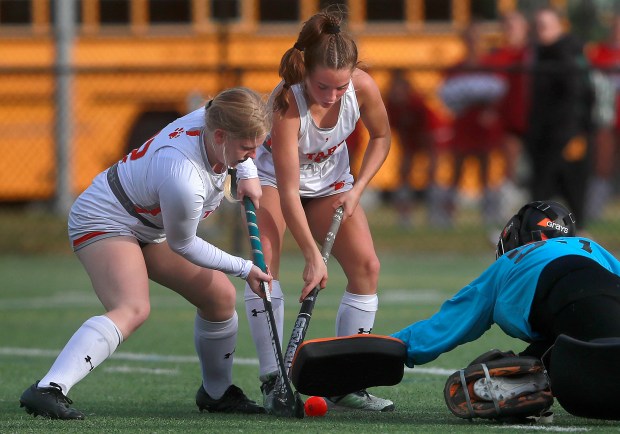 Tabb's Erica Lombardo, right, and Gillian Rice go after the ball as Meridian goalie Briana Corry closes in during Saturday's Class state championship match. (Stephen M. Katz/The Virginian-Pilot)