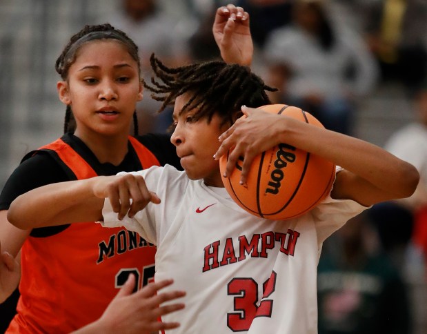 Hampton's Kaliya Perry wrestles the rebound in the Crabbers' state semifinal win over Monacan. Perry made the Class 4 all-state first team. (Stephen M. Katz/The Virginian-Pilot)