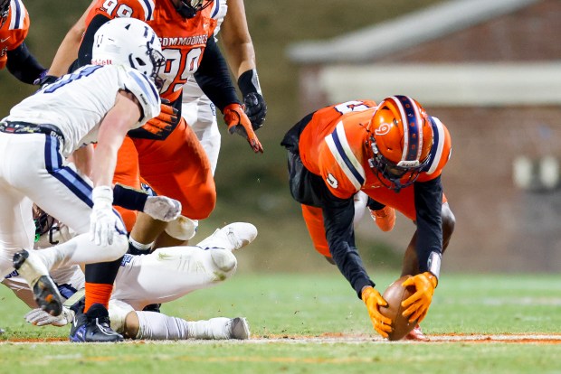 Maury's Fred Johnson (9) dives to recover a fumble by Stone Bridge during the Class 5 state championship game Saturday at Scott Stadium in Charlottesville. (Billy Schuerman / The Virginian-Pilot)