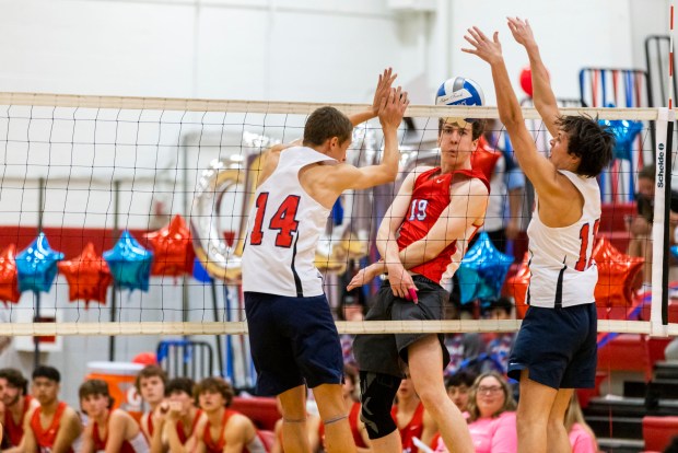 Grassfield's Illia Antoniuk, left, and Daniel Morin try to block a spike from Kempsville's Ryan Pecora during an Oct. 24, 2023, match. KENDALL WARNER/STAFF