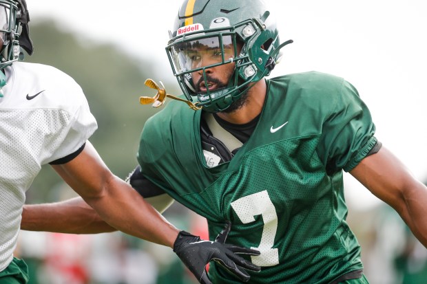 Daylan Long (7) runs through drills during practice at Norfolk State University in Norfolk, Virginia, on July 30, 2024. (Billy Schuerman / The Virginian-Pilot)