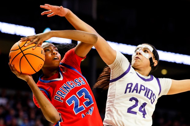 Princess Anne Micah Ojo (23) drives past James River defender Seimone Newton (24) on her way to the rim. Princess Anne faced James River in the VHSL Class 5 State Championship at the Siegel Center in Richmond, Virginia, on March 9, 2024. (Billy Schuerman / The Virginian-Pilot)