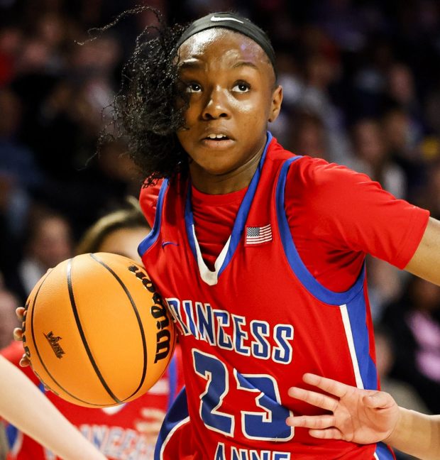 Princess Anne Micah Ojo (23) drives past James River defender Seimone Newton (24). Princess Anne faced James River in the VHSL Class 5 State Championship at the Siegel Center in Richmond, Virginia, on March 9, 2024. (Billy Schuerman / The Virginian-Pilot)