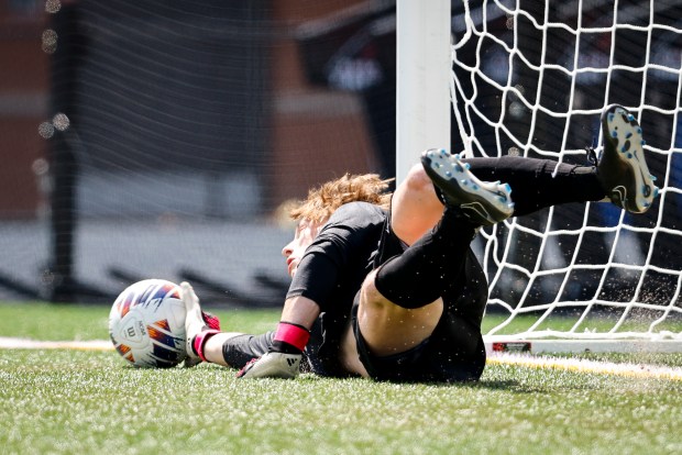 Cox goalkeeper Sam Braidwood (1) blocks a penalty kick attempt. Cox defeated Albemarle 1-1 (5-3) in penalty kicks in the class 5 soccer state championships at J.R. Tucker High School in Henrico, Virginia, on June 8, 2024. (Billy Schuerman / The Virginian-Pilot)