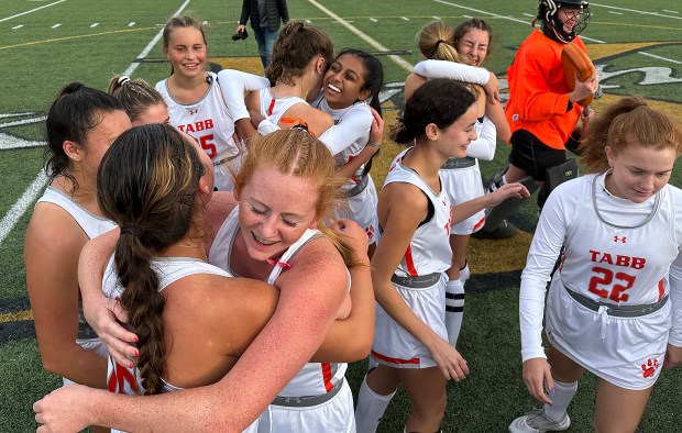 Tabb field hockey players celebrate their win over Meridian on Nov. 11, 2023, in the VHSL field hockey state championships at Kempsville High School. (Stephen M. Katz/The Virginian-Pilot)