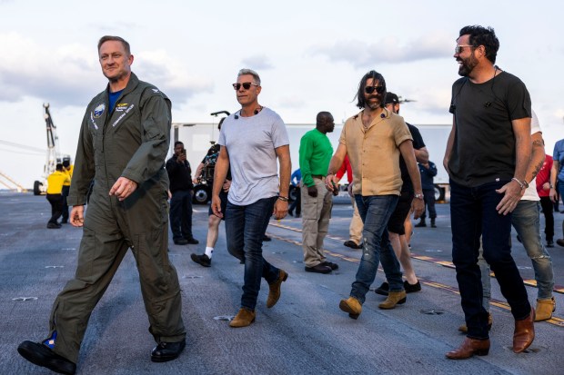 Commanding officer Rick Burgess leads the country music band Old...