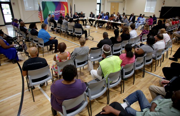 Dozens of concerned citizens gather at the Mary Jackson Neighborhood Center in Hampton for Sen. Mark Warner's Roundtable Discussion on Gun Violence on Friday, July 19, 2024. (Stephen M. Katz / The Virginian-Pilot)